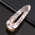 Detail of marble pattern acetate hair clip with golden metal clip on black reflective surface - Acetate Grey Marble Waterdrop
