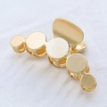Minimalist gold metal hair claw clip featuring a polished disc design and spring mechanism - Matte Gold