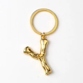 Golden metal keychain featuring a letter Y pendant with unique branch texture on white background - Letter Y