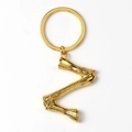 Golden metal letter Z keychain with bamboo texture design on white background - Letter Z