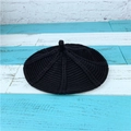 Classic black knitted cable knit beret hat with a small top tail on a striped wood background - One Size(56-58cm) / Black