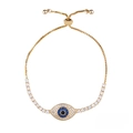 Detailed view of golden evil eye bracelet with white zircon inlay and box chain - Gold Blue Eye (a39-G)