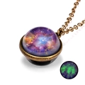 Luminous galaxy glass dome necklace with vintage bronze chain showing green glow in the dark - Nebula