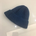 Detailed view of the dark blue rib-knit texture and cuffed edge of the winter wool beanie - One Size (Elastic) / Dark Blue