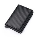 Detail of slim carbon fiber RFID blocking card holder with automatic pop-up lever mechanism - Carbon Fiber Black