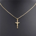Detail view of a gold cross pendant with Jesus figure and zircons on a box chain - Style D
