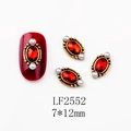 Detail of vintage red oval nail art charm with gold wavy border and tiny pearls - 2552 Red