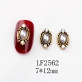 Close-up of vintage oval nail art charms with pearls and colorful rhinestones on nails - 2562 White Pearl