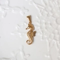 Detailed close-up of a 18K gold-plated seahorse pendant with polished finish details - G04-Seahorse
