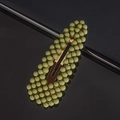 Macro shot of dusty green matte pearl hair clip with metal base on black reflective surface - Bean Green Waterdrop