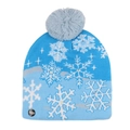 Detail of blue snowflake knit hat featuring integrated LED light power switch - Blue Snowflake