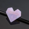 Macro shot of pink heart-shaped acetate hair clip with iridescent finish on black surface - Heart / Light Purple
