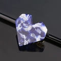 Close-up of heart-shaped blue and white marble pattern acrylic hair clip on black base - Heart / Porcelain Blue
