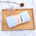 Light blue coral fleece towel, soft and thick, rolled with a pink Joy Life paper band - 35*75cm / Blue