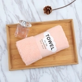 Light pink coral fleece towel folded with paper sleeve on wooden tray for home use - 35*75cm / Pink