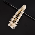 Macro detail of rectangle gold hair clip with white pearls on reflective surface - 9cm Pearl Large Waterdrop Gold