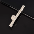 Detailed close-up of handmade white pearl hair clip with silver metal base and glossy finish - Ball Shape Barrette