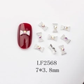 Close-up of 7x3.8mm silver bow nail art charms with colorful rhinestones and dimensions - Silver Alloy Bow AB Rhinestone (LF2568)