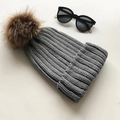 Winter chunky knit beanie in grey featuring a large brown faux fur pom-pom - Dark Gray