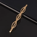 Minimalist gold metal hair clip featuring a stylish wave woven design on black background - Three Ovals Metal Bobby Pin