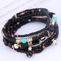 Bohemian multilayer beaded bracelet with black and gold beads in chic stacked style - Black