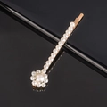 Detailed view of handmade pearl bow hair clip with gold alloy base on a sleek black background - Sunflower Bobby Pin