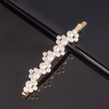 Macro detail of elegant gold-toned hair clip featuring cluster of white faux pearls - 7-Small Flower Bobby Pin