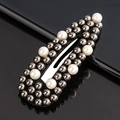 Detail showing dark gray metal beads and white faux pearls on a stylish snap hair clip - White & Gun Black Beads