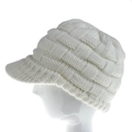 Detailed knit texture of white winter beanie with visor on mannequin head - White