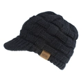 Detail of black thick cable knit beanie with visor showing leather brand label and texture - Black