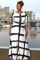 Outdoor view of elegant black and white geometric pattern maxi dress with half sleeves - White