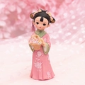 Detail of pink resin doll with hand-painted embroidery flowers and floral headpiece - 1060-12-13 Flower Basket