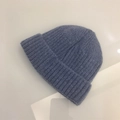 Close-up of blue knit beanie showing vertical ribbed texture and folded cuff detail - One Size (Elastic) / Blue