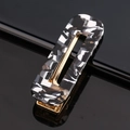 Detail view of a rectangular cutout acetate hair clip with black and white marble texture - Acetate Black Marble Square