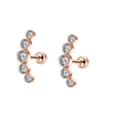 Macro view of rose gold screw-back studs with five zircons in a curved layout - Rose Gold Curved Cluster