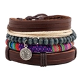 Detailed macro view of St. Benedict medal on layered leather and wood bead bracelet - N024 Saint Benedict Medal Ethnic Set