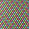 Detailed view of colorful polka dots on black cotton fabric showing texture and pattern - Colored Polka Dots