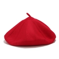 Detailed close-up of the bright red wool knit beret showing ribbed texture and top stem - M (56-58cm) / Red