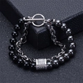 Macro shot of double-layer men's bracelet with black onyx beads and silver chain link - Obsidian And Hematite Bracelet