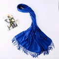 Detail of blue cashmere wool scarf with soft fringe edges and premium woven texture - Royal Blue