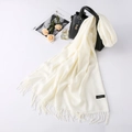 Cream cashmere wool scarf with fringe detail styled with fashion accessories on a white surface - Milk White