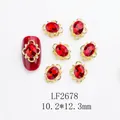 Gros plan sur breloque ongle LF2678 avec gemme ovale rouge et monture dorée 10x12mm - Ovale Strass Rouge Or (LF2678)