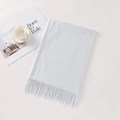 Light blue cashmere-like scarf with soft tassels in a stylish folded flat lay style - Light Gray