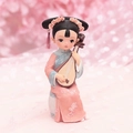 Detail of pink vintage figurine girl playing pipa with soft blurred floral background - 1060-12-13 Pipa Style