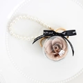 Preserved champagne rose keychain with pearl strap and black ribbon bow detail - Khaki