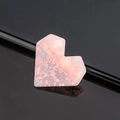Macro detail of a pink heart-shaped acetate hair clip with glitter and reflections - Heart / Sequined Pink