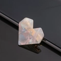 Macro detail of rainbow marble heart hair clip with golden metal hardware components - Heart / Gray
