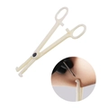 Professional beige plastic piercing forceps and insert showing body piercing usage - Slanted Slotted Pliers