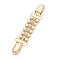 Dettaglio di una clip dorata vintage per cardigan con strass e doppie clip in metallo - 10. Sei Diamanti Oro