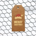 Brown kraft paper Christmas gift tag with festive Santa hat and Merry Christmas text - Simple Style B